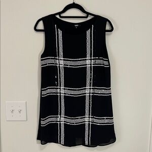 Elegant Black and White Checkered Sleeveless Tunic